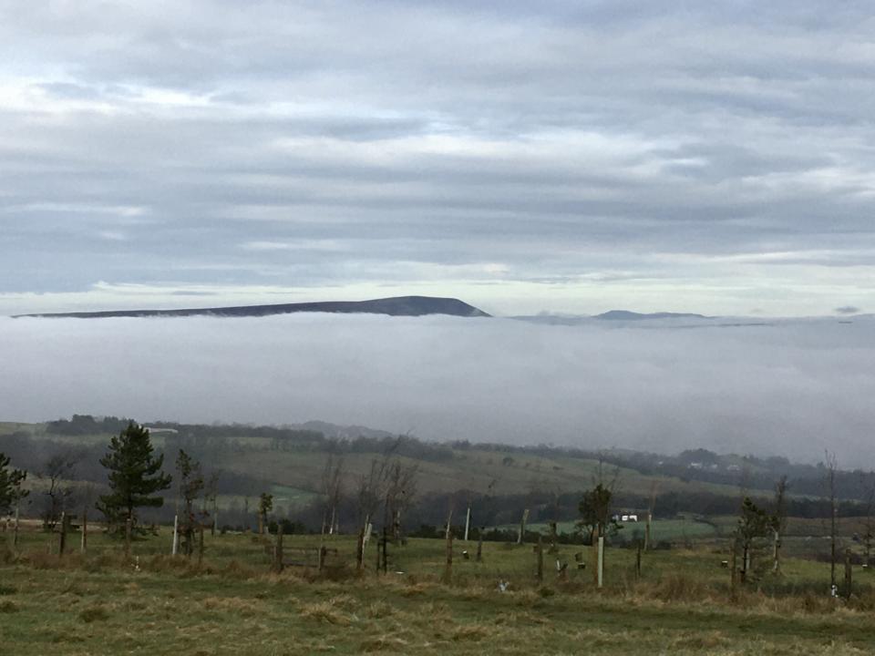 Pendle peeping out of the clouds. 