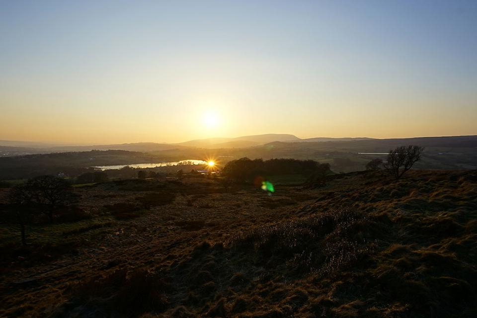 The sun sets behind Pendle Hill, from Noyna Hill above Foulridge, 28th February 2021