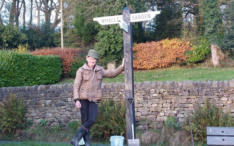 Duncan Armstrong with newly refurbished Fingerpost