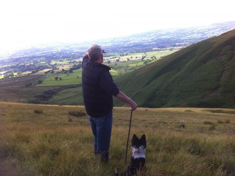 Bobbie Gill gathering the sheep off Pendle Hill Sabden, stopping to admire the view