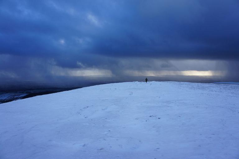 Snow filled winter skies